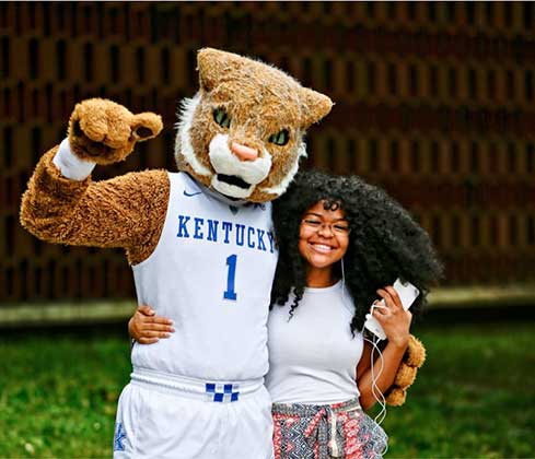 mascot hugging female student